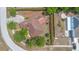 An aerial view of a single Gathering home with a brick walkway and mature trees at 2478 Unionville Dr, Deltona, FL 32725