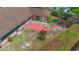 Aerial view of a backyard with a brick path leading to a fountain with mature trees at 2478 Unionville Dr, Deltona, FL 32725