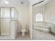 Bathroom with shower, toilet, and a mirrored door reflecting the soaking tub at 2478 Unionville Dr, Deltona, FL 32725