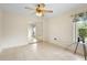 Bright bedroom featuring tile floors, ceiling fan, and closet with mirrored sliding doors at 2478 Unionville Dr, Deltona, FL 32725