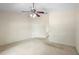 Bright bedroom with a ceiling fan, neutral walls, and an open doorway at 2478 Unionville Dr, Deltona, FL 32725