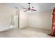 Spacious bedroom featuring a ceiling fan, carpeted floor, and neutral wall colors at 2478 Unionville Dr, Deltona, FL 32725