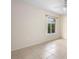 Bedroom featuring a ceiling fan, tile flooring, and a window at 2478 Unionville Dr, Deltona, FL 32725