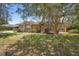 Charming brick home with a manicured lawn and mature landscaping at 2478 Unionville Dr, Deltona, FL 32725