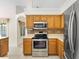 Well-equipped kitchen with stainless appliances and stylish backsplash at 2478 Unionville Dr, Deltona, FL 32725