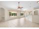Bright living area with large windows offering views of the backyard at 2478 Unionville Dr, Deltona, FL 32725
