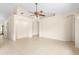 Spacious living room with neutral walls, tile floors, and a ceiling fan fixture at 2478 Unionville Dr, Deltona, FL 32725