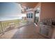 A serene balcony boasts an outdoor grill, offering an ideal space for relaxation and enjoying panoramic ocean views at 2515 S Atlantic Ave # 203, Daytona Beach, FL 32118