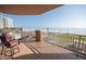 A serene balcony features comfortable seating and breathtaking ocean views, creating a perfect retreat at 2515 S Atlantic Ave # 203, Daytona Beach, FL 32118
