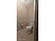Powder room features standard toilet with neutral color scheme at 2515 S Atlantic Ave # 203, Daytona Beach, FL 32118