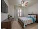 Bedroom features a ceiling fan, television, dresser, and decorative valance at 2515 S Atlantic Ave # 203, Daytona Beach, FL 32118