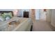 Close up of bright bedroom featuring furnishings and balcony with ocean view at 2515 S Atlantic Ave # 203, Daytona Beach, FL 32118