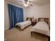 Inviting bedroom featuring two beds, a ceiling fan, and ample natural light at 2515 S Atlantic Ave # 203, Daytona Beach, FL 32118