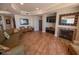 Comfortable common area with a fireplace, TV and cozy seating at 2515 S Atlantic Ave # 203, Daytona Beach, FL 32118