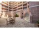 View of a courtyard with stairs and outdoor seating area at 2515 S Atlantic Ave # 203, Daytona Beach, FL 32118