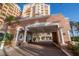 Elegant covered entrance with brick columns, arched windows, and ample parking at 2515 S Atlantic Ave # 203, Daytona Beach, FL 32118