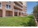 Condominium exterior with lawn and walk-out patios at 2515 S Atlantic Ave # 203, Daytona Beach, FL 32118