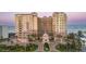 A stunning beach-front condo features elegant Mediterranean architecture, lush landscaping, and breathtaking ocean views at 2515 S Atlantic Ave # 203, Daytona Beach, FL 32118