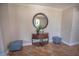 Foyer with tiled floors, decorative table, mirror and seating at 2515 S Atlantic Ave # 203, Daytona Beach, FL 32118