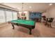 Spacious game room featuring a pool table and comfortable seating at 2515 S Atlantic Ave # 203, Daytona Beach, FL 32118