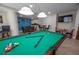 Spacious game room featuring a pool table and comfortable seating at 2515 S Atlantic Ave # 203, Daytona Beach, FL 32118