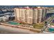 Aerial shot showing a condominium's pool deck with lounge chairs overlooking the beach at 2515 S Atlantic Ave # 203, Daytona Beach, FL 32118