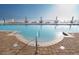Inviting pool with clear blue water and lounge seating for relaxing by the water at 2515 S Atlantic Ave # 203, Daytona Beach, FL 32118