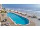 Oceanfront pool and lounging area with ocean views at 2515 S Atlantic Ave # 203, Daytona Beach, FL 32118