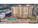 Aerial view of the condominium with a large outdoor pool and lounging area at 2515 S Atlantic Ave # 203, Daytona Beach, FL 32118