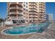 Stunning pool at the beachfront condominium with lounge chairs and ocean views at 2515 S Atlantic Ave # 203, Daytona Beach, FL 32118