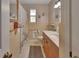 Bathroom with a large vanity, tub, and neutral tile at 2676 Palm Terrace St, Deland, FL 32720