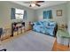 Bright bedroom featuring hardwood floors, a ceiling fan, and plentiful natural light at 2676 Palm Terrace St, Deland, FL 32720