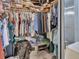 Walk-in closet featuring ample storage space for clothing and accessories, with a shower visible at 2676 Palm Terrace St, Deland, FL 32720