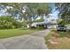 Charming home featuring a long driveway, spacious front yard, and classic curb appeal at 2676 Palm Terrace St, Deland, FL 32720
