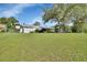 Spacious front yard and exterior view of the home showcasing its setting and curb appeal at 2676 Palm Terrace St, Deland, FL 32720