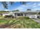 Charming single-story home featuring a well-maintained lawn and an attached two-car garage at 2676 Palm Terrace St, Deland, FL 32720