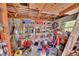 A look inside the garage, revealing ample storage with shelving and a well-organized workspace at 2676 Palm Terrace St, Deland, FL 32720