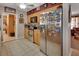 Cozy kitchen featuring tile floors, stainless steel appliances, and wooden cabinetry at 2676 Palm Terrace St, Deland, FL 32720