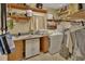 Practical laundry room with a washer, dryer, sink, and shelving at 2676 Palm Terrace St, Deland, FL 32720