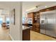 Well-appointed kitchen with stainless steel appliances and a view to the ocean from the living room at 2801 Hill St # 801, New Smyrna Beach, FL 32169