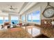 Living room area with ocean views through large windows and comfortable seating at 2801 Hill St # 801, New Smyrna Beach, FL 32169