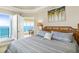 Relaxing main bedroom with balcony access and ocean views at 2801 Hill St # 801, New Smyrna Beach, FL 32169
