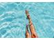 Relaxing in the clear blue water of the community pool, on a summer day at 2801 Hill St # 801, New Smyrna Beach, FL 32169