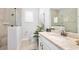 Bathroom featuring granite counters, undermount sink, a glass enclosed shower, and tile floors at 2825 S Asciano Ct, New Smyrna Beach, FL 32168