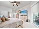Bright, cozy bedroom with ceiling fan, dresser, access to the patio and plenty of natural light at 2825 S Asciano Ct, New Smyrna Beach, FL 32168