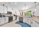 Well-equipped kitchen with white cabinets, granite countertops, and stainless steel appliances at 2825 S Asciano Ct, New Smyrna Beach, FL 32168