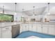 Kitchen with granite countertops, white cabinetry, and stainless steel appliances at 2825 S Asciano Ct, New Smyrna Beach, FL 32168
