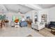 Bright living room with tile floors, ceiling fan, and comfortable seating at 2825 S Asciano Ct, New Smyrna Beach, FL 32168