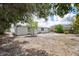 The home features a spacious backyard with trees and a light-colored exterior at 2831 Fifer Dr, Deltona, FL 32738