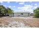 The home features a spacious backyard with a light-colored exterior at 2831 Fifer Dr, Deltona, FL 32738